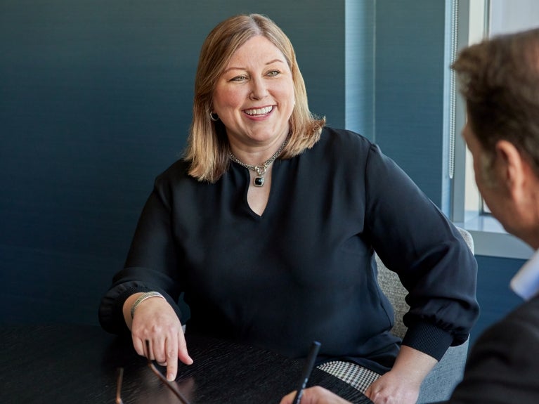 Perkins Coie lawyers reviewing documents at a table