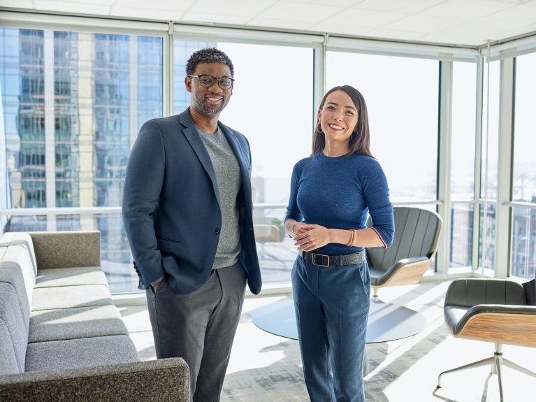 Two firm employees in an office