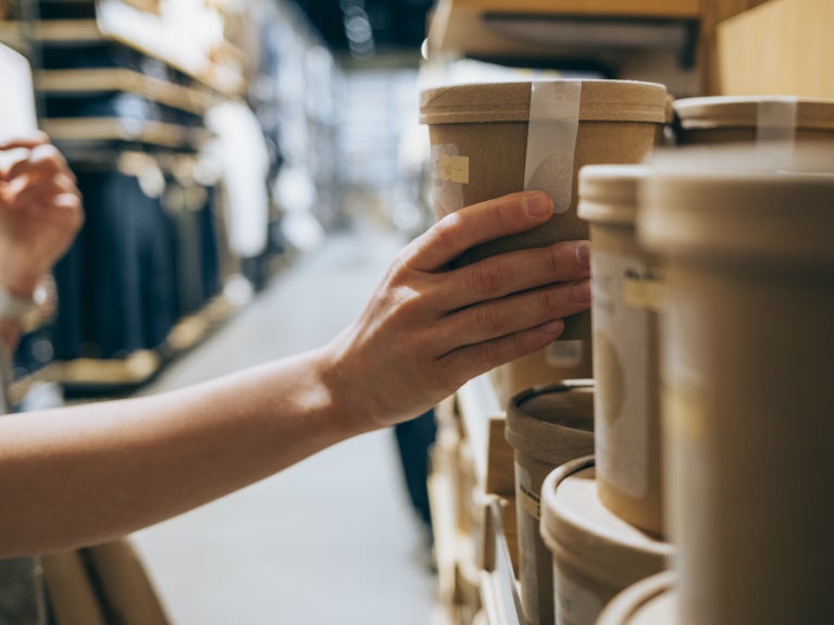 Shopper picking up container