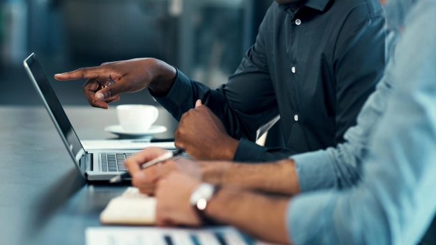 People sitting in front of a laptop