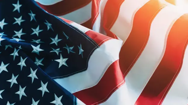 American Flag or United States of America national flag background in sunlight, close up.